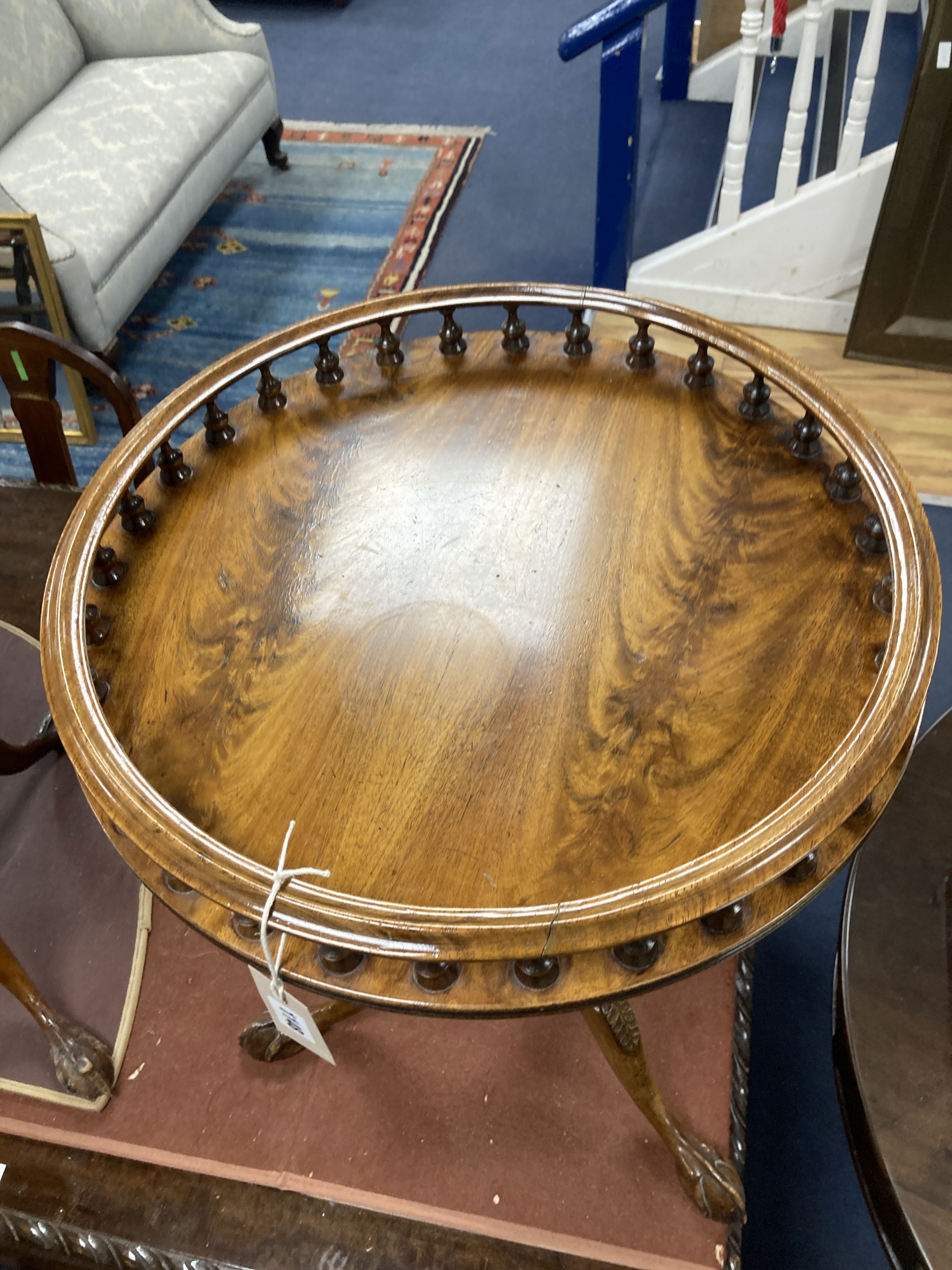 A pair of reproduction George III style mahogany galleried tripod wine tables, 48cm diameter, height 63cm